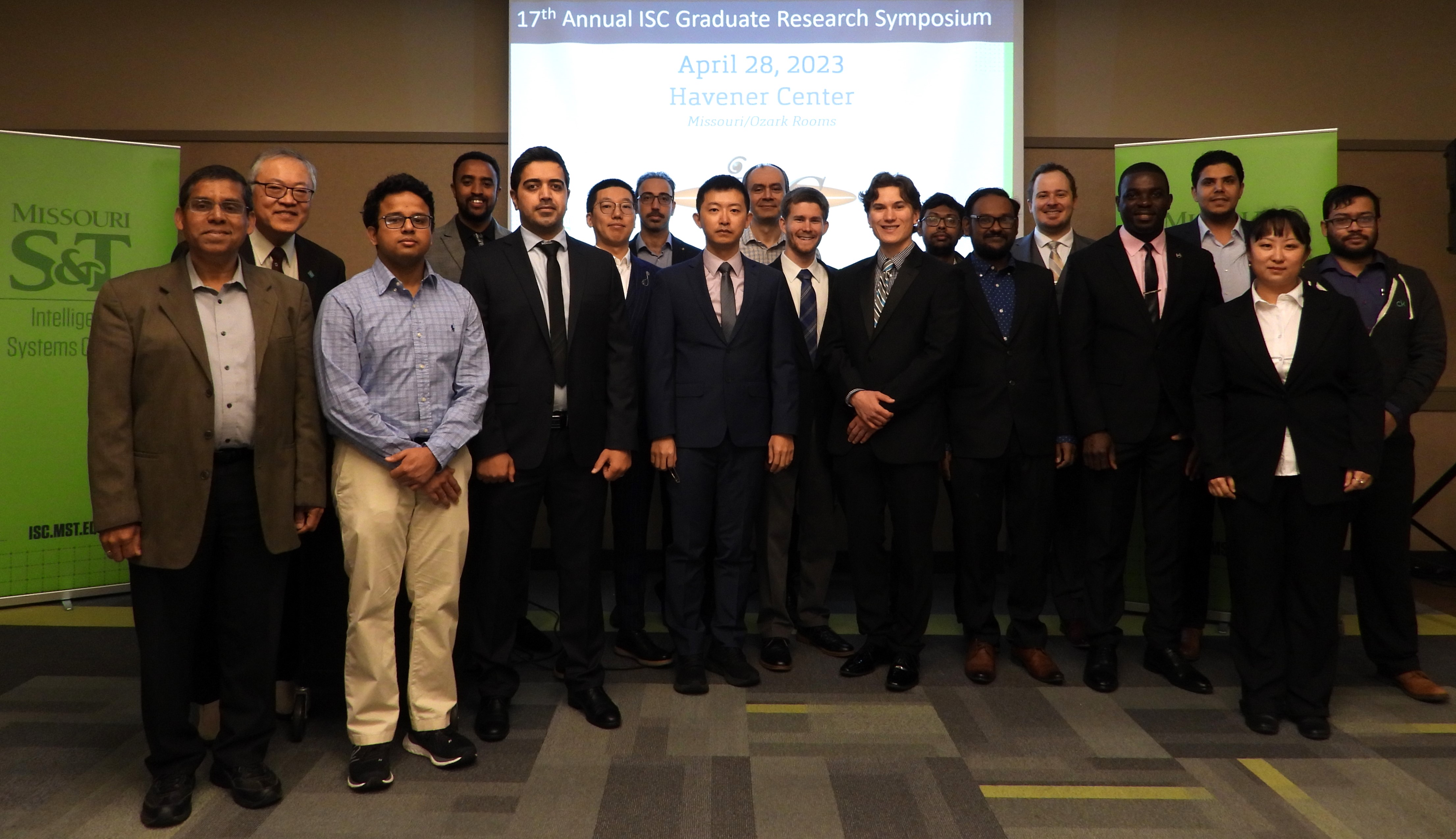 Group of students and judges smiling at the 17th annual ISC Graduate Research Symposium